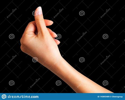 Woman Hand Holding Something With Two Fingers Stock Image