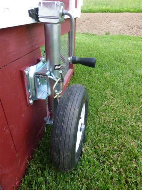 wheel barrow tire attached  trailer jack idea  movable livestock housing mobile chicken