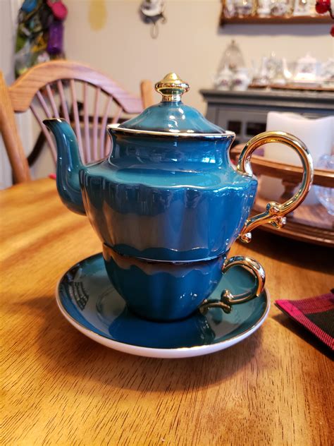 bought   beautiful tea pot cup  saucer