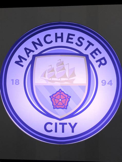 manchester city unveil  club badge manchester football