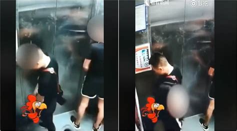 video two men pee inside an elevator woman tries to block the camera
