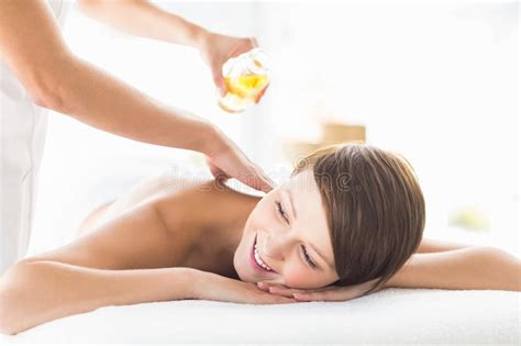Masseur Pouring Massage Oil On Woman Stock Image Image