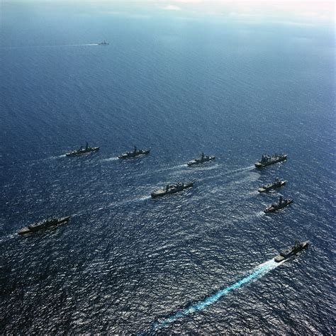 an aerial port side view of the us navy usn parade formation underway