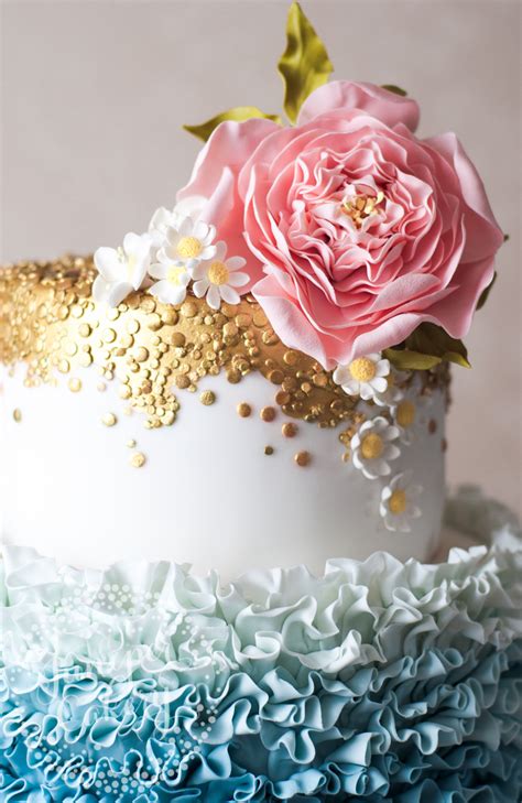pretty blue ombre ruffled wedding cake  sugar daisies
