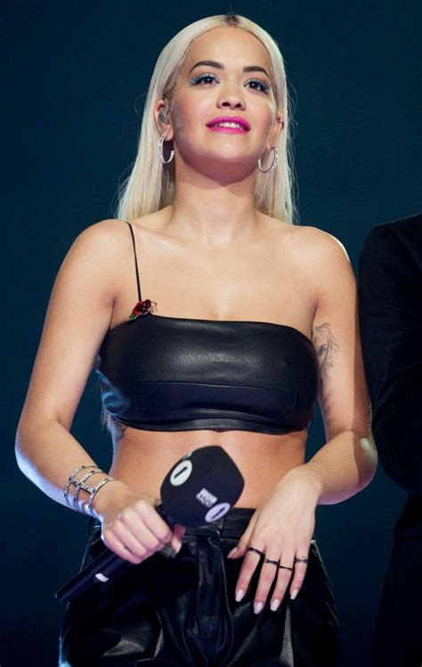 rita ora oozes sex in leather crop top and trousers at