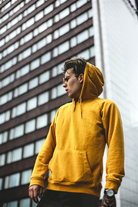photography  guy wearing yellow hoodie  stock photo