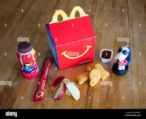 a mcdonald s happy meal with chicken mcnuggets apple wedges chocolate