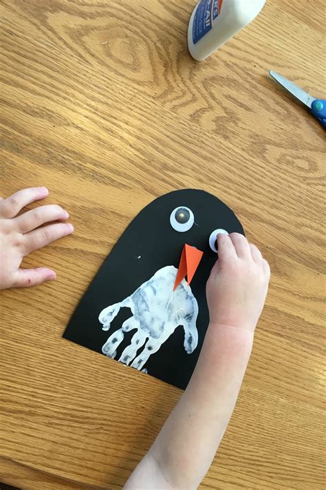 toddler approved handprint penguin craft