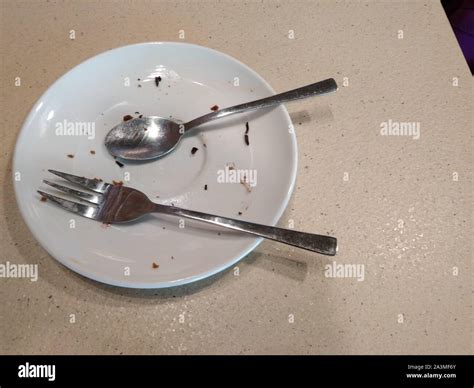 plate  crumbs   fork  wood background  copy space stock photo alamy