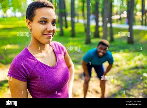Fit Young Tired African American Couple In Sport Activity Outdoors Runs