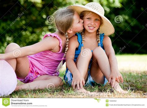 kiss on my sisters cheek royalty free stock image