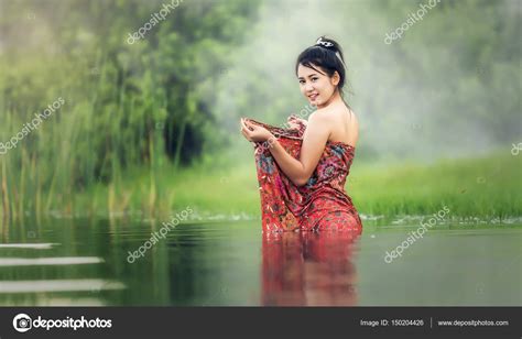 thai women bathing thai woman bathing in the river