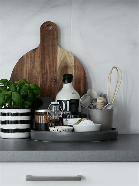 organizing  kitchen counter   tray  greenery