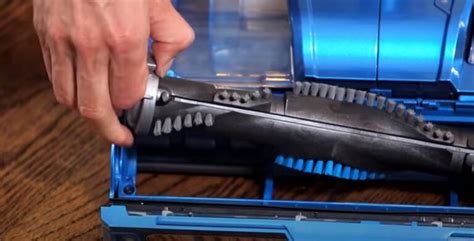 remove roller brush  shark rocket vacuum quickly