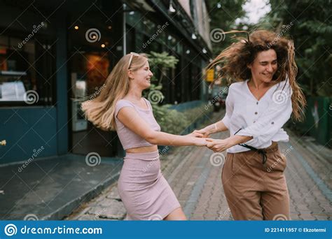 two lesbians having fun on the street stock image image of love