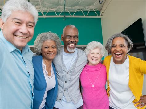 diverse group  seniors smiling   arms    deborah foundation
