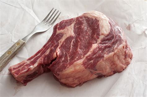 thick juicy fatty uncooked rib eye beef steak  stock image