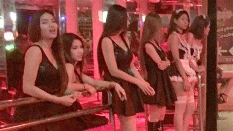 thailand sex workers wearing black to honour late king
