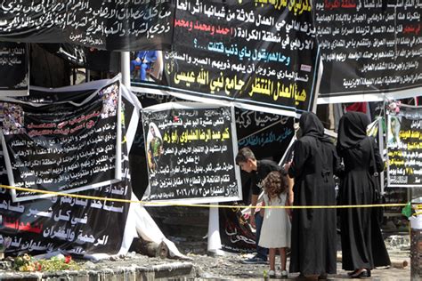 Iraqis Gather On Thursday Next To Banners Of Condolences