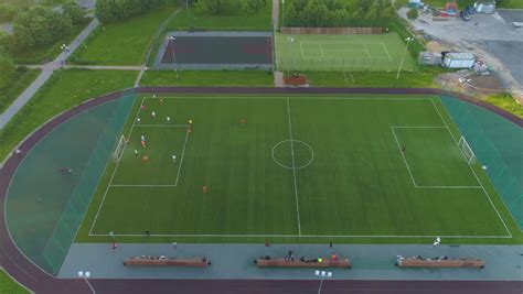 aerial view  football team practicing  day  soccer field  top view stock footage video