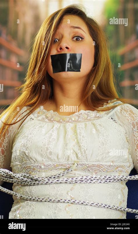 Scared Beautiful Young Woman Being Silenced With Tape On Her Mouth