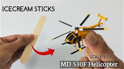 making  tiny helicopter  popsicle sticks