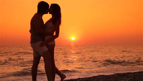 couple kissing by the ocean at sunset stock footage video 5450744 shutterstock