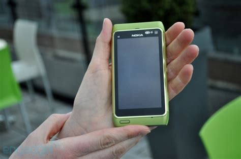 a green nokia n8 teases in front of the camera looks big