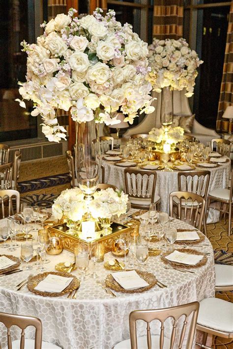 tablescape  white flower centerpieces  gold details