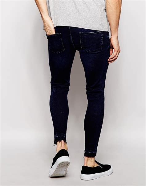 asos extreme super skinny jeans with raw hem in blue for men lyst