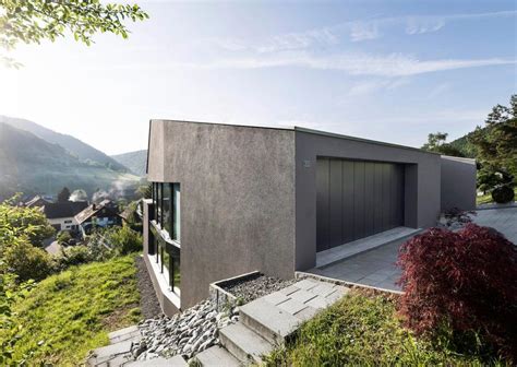 single family house built steep slope leads centre village  family house architecture