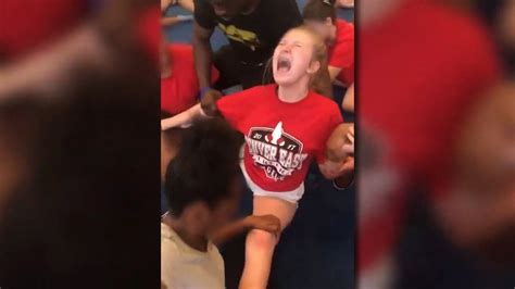 Videos Show Cheerleaders Repeatedly Forced Into Splits