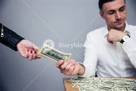 unhappy man giving money to woman royalty free stock image storyblocks