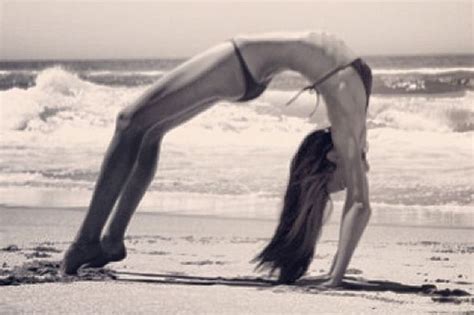 Miranda Kerr In A Bikini On The Beach In Yoga Pose The