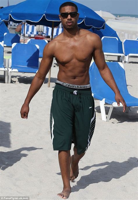 that awkward moment s michael b jordan shows off his chiseled chest as he jet skis with a