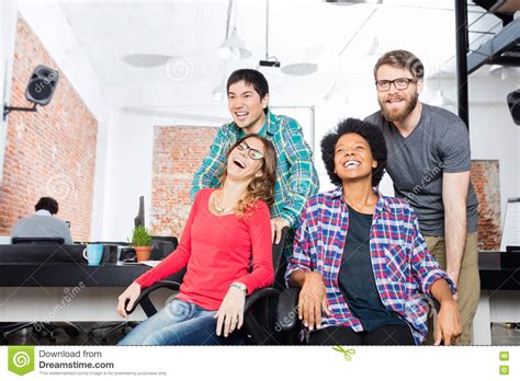 business people fun playing office chair race stock image