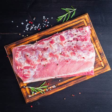big  piece  raw beef meat striploin  white parchment paper