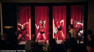 men cheer on dancing half naked women in amsterdam s red light district but are shocked to find
