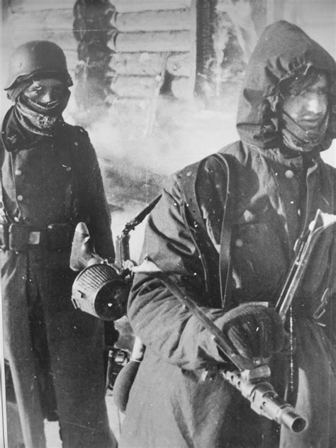two freezing germans the one carrying a mg 34 light mg