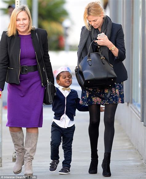 charlize theron s son dons a paper crown with mum and