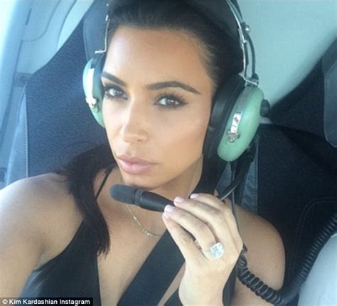 kim kardashian dons plunging black jumpsuit for helicopter ride to new