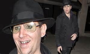 Marilyn Manson Flashes His Outrageous Silver Teeth While Strolling Solo