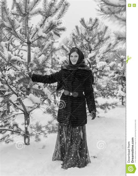 russian beautiful girl near the christmas tree in the woods stock image