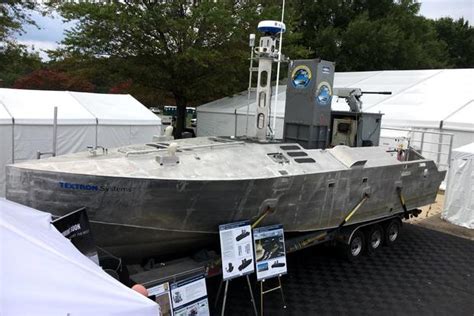 textron shows   hunting drone boat armed  hellfire missiles militarycom