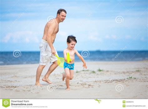 Father And Son Having Fun On The Beach Stock Image Image