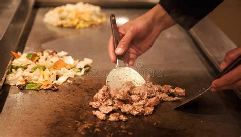 chinese cook prepares spicy dish fried beef and vegetables hands chefs prepare chinese food