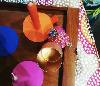 assortment  colorful objects   wooden tray  polka dot table cloth  decorative items