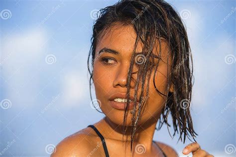 Young Beautiful And Asian Girl In Bikini With Wet Hair Enjoying