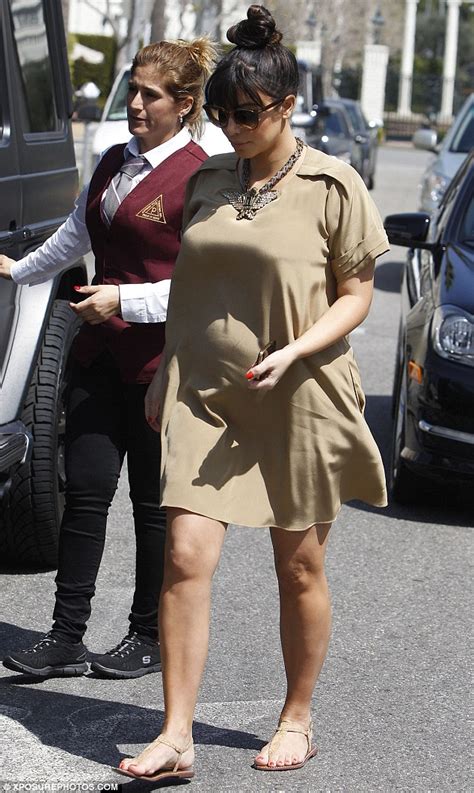 so much for the maternity wear pregnant kim kardashian ditches the roomy attire and steps out