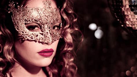 macro closeup of sexy woman wearing masquerade mask at